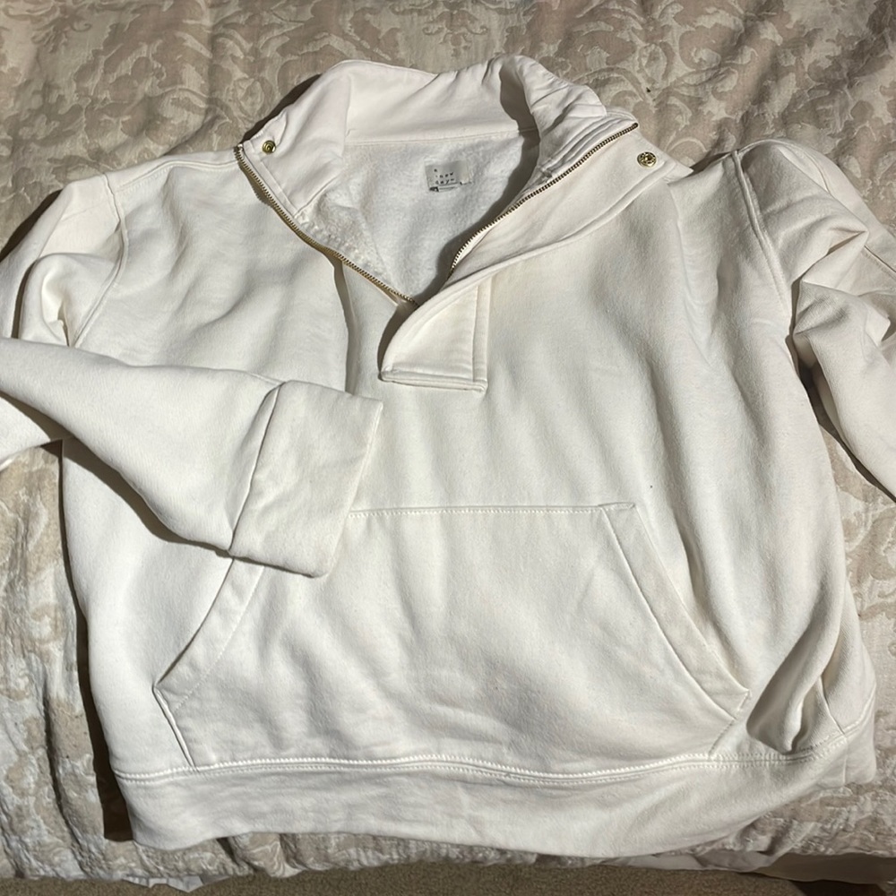 A New Day pullover with gold accents